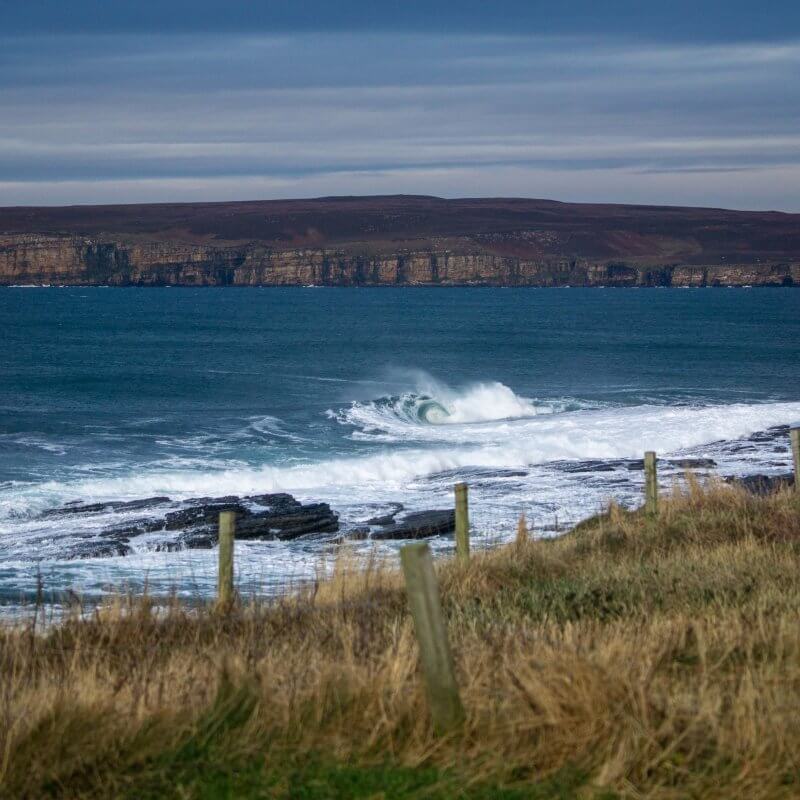 A photograph of waves crashing off the coast of Scotland