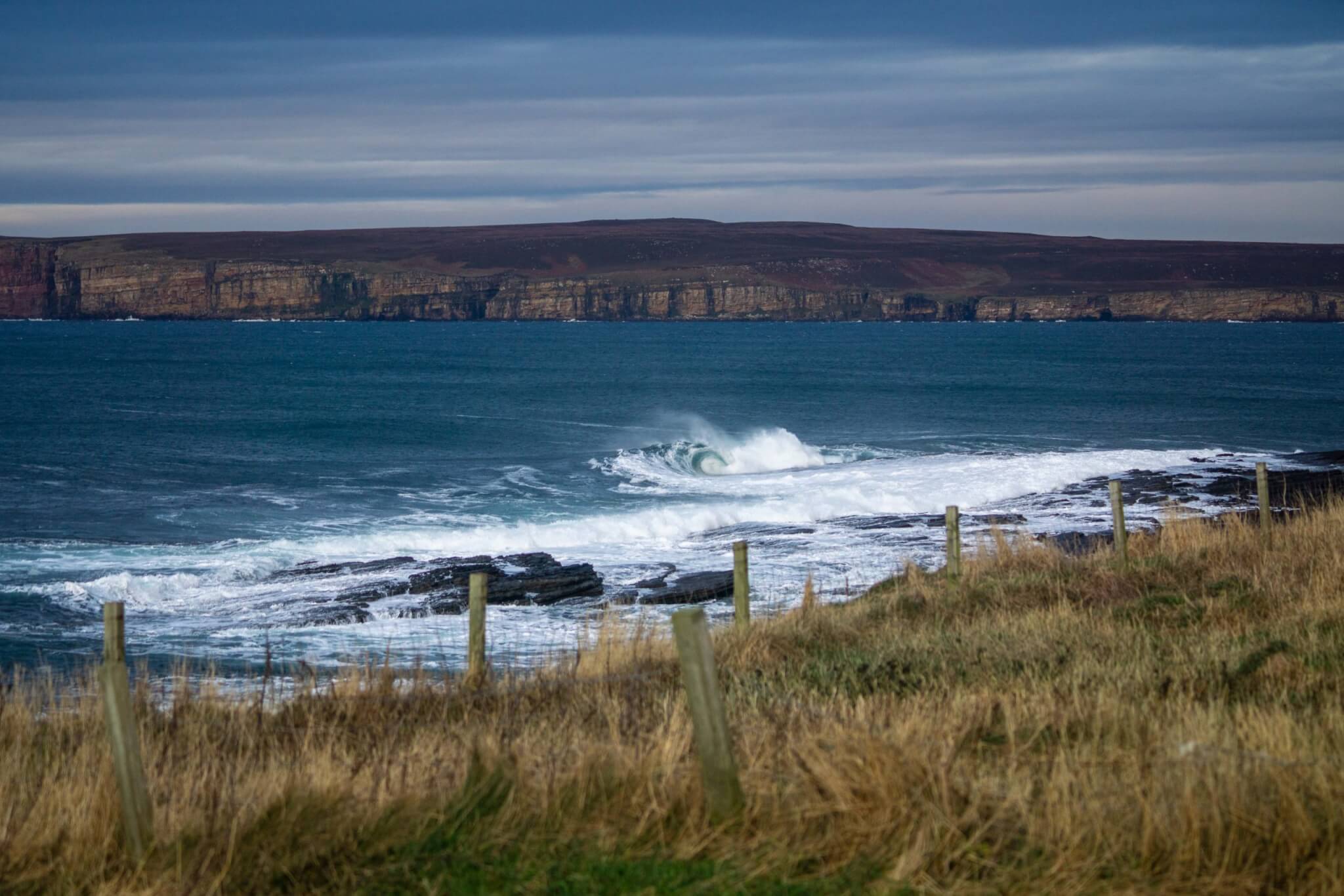 A photograph of waves crashing off the coast of Scotland